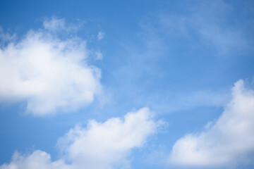 Naklejka na ściany i meble Soft white clouds fluffy in the clear sky
