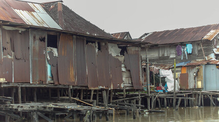 Wooden house on Karang Mumus Riverbank. Slum area on Karang Mumus river, Samarinda, Indonesia