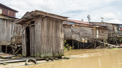 wooden toilet on Karang Mumus riverbank, Samarinda. Slum area of Samarinda, Indonesia