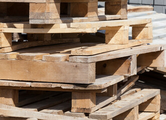 empty wooden pallets and new construction tiles