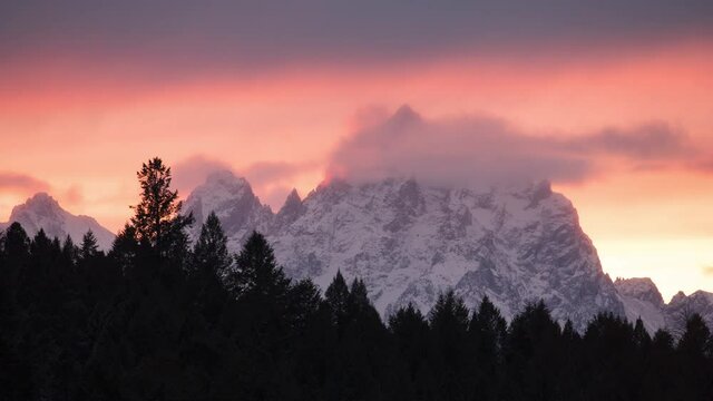 Grand Teton National Park Timelapes, Sunset with tree line and the Grand Teton. 