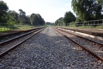 Fototapeta na wymiar railway track on stone and forest background