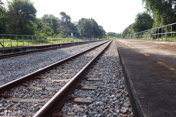 Fototapeta na wymiar railway track on stone and forest background