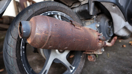 Rusted exhaust with motorecycle.