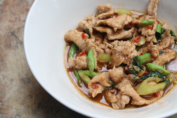 Popular street food in Thailand. Stir Fried Pork with Basil , Chili ,Bell Pepper and Long Bean or  Phat Gaphrao Muu  in Thai language. 