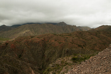High in the Andes mountains. Beautiful view of the red and green hills in the popular landmark Miranda Slope in La Rioja, Argentina.