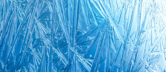 Winter frost covered window with a pattern of ice crystals.