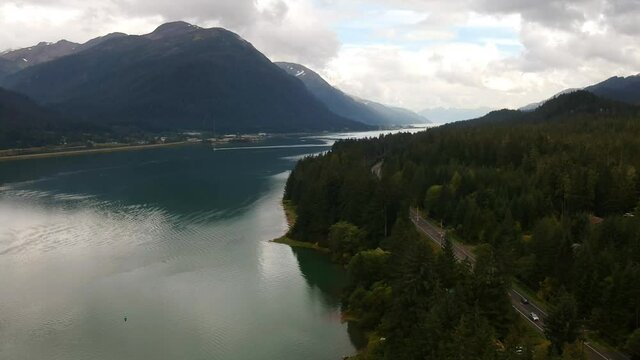 Scenic Road in Mountainous Landscape in Alaska, USA. Aerial Establishing View