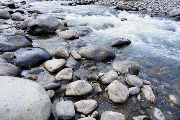 big rocks in the river with clear water