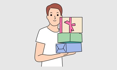 Man hold gift box in front of him in arms