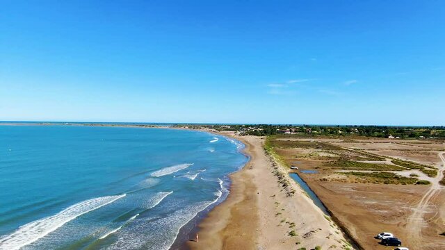 Drone flying over the beaches of the Ebro delta, the river with the highest flow in Spain, at its mouth. Beach in Tarragona (Spain), "Costa Dorada".