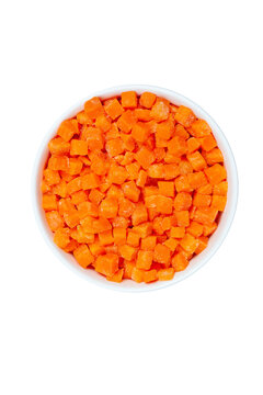 Top View Of Frozen Diced Carrots In A Bowl On White Background, Close Up