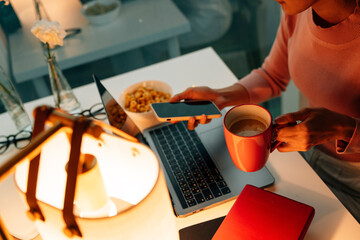 Woman freelance enjoy meal while working at home.