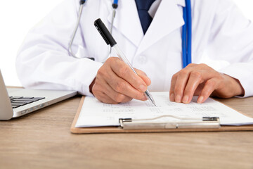 Doctors in white coats are signing relevant documents