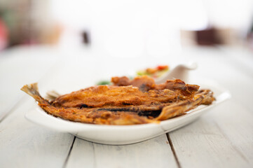 Deep fried Fish and green mango salad