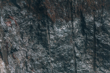 Gray rock. A cut of a stone rock with traces of stone processing
