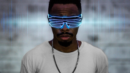 Black man wearing a blue light eyeglasses - obrazy, fototapety, plakaty