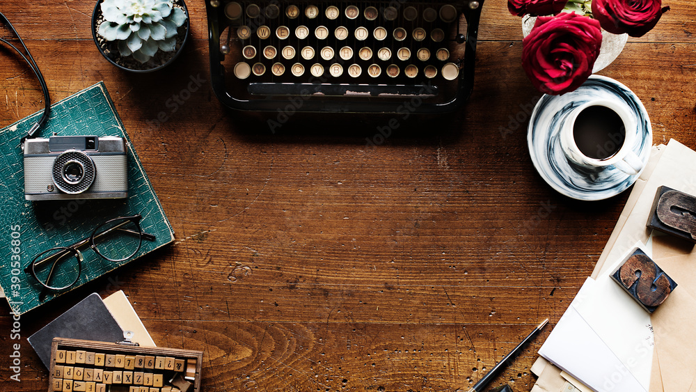 Wall mural retro typewriter on a wooden table website banner template