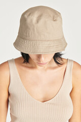 Woman in a beige bucket hat