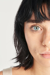 Fototapeta premium Half face beautiful woman with blue eyes