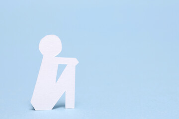 切り絵の落ち込む人