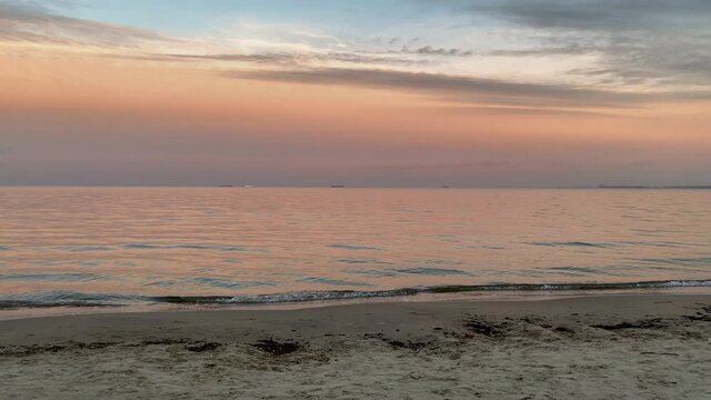 Panoramic View Of Calm Ocean From The Beach At Sunset In Gdynia, Poland. - panning shot
