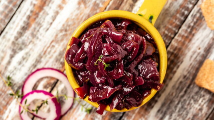Homemade DIY natural healthy red onion marmalade jam, confiture, chutney in jar. Vegetable jam on wooden background. French cuisine, Long banner format
