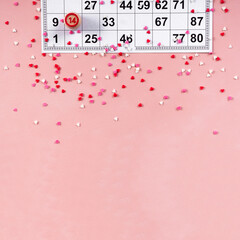 Lotto ticket with wood barrel 14 number on pink hearts background. Valentines day 14 february minimal concept. Square format