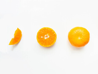 Orange fruits turned into full-size sets, half cubes, and halves. Show a fine pattern of orange skin Slices of orange pulp White background.Copy space