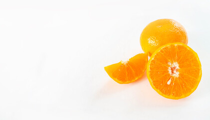 Orange fruits turned into full-size sets, half cubes, and halves. Show a fine pattern of orange skin Slices of orange pulp White background.Copy space