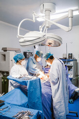 Surgery room in Latin america, hispanic surgerons working on an emergency
