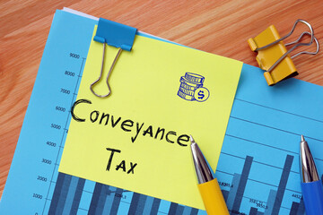 Business concept meaning Conveyance Tax with phrase on the piece of paper.