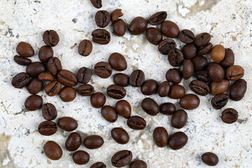 Fresh Coffee Beans from Above Close Up on a Marble Texture Background