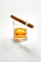 NO LOGOS OR TRADEMARKS!  SELF MADE LABELS! Closed up view of glass of whiskey with cigar on top on white back