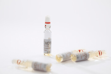 Close up view of the ampules with medicine on white back 