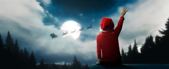 child surprised to see santa claus on beautiful christmas night under moonlight