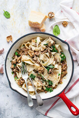 Homemade pappardelle pasta with mushrooms