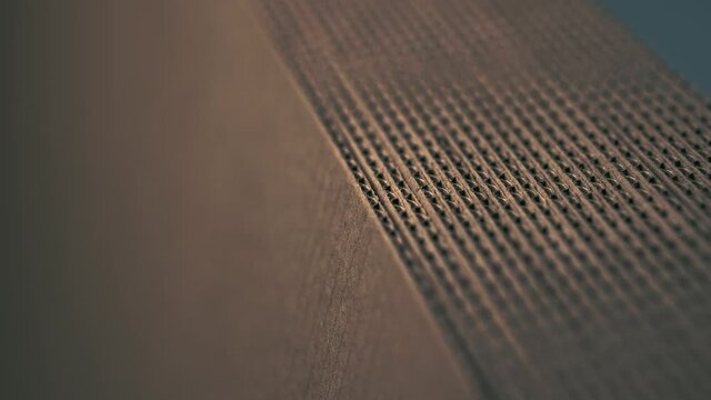 A stack of evenly folded brown&nbsp;cardboard.&nbsp;Close-up.