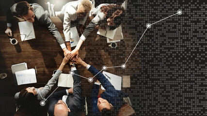 Obraz na płótnie Canvas Business people stacking hands together