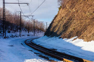 railroad in mountains. frosty winter landscape. transportation scenery