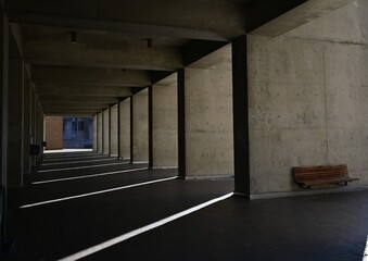 cement corridor in the building with shadows