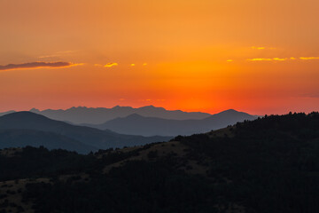 sunset over mountains shade