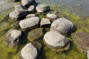 Obraz na płótnie Canvas Large stones at Baltic sea shore