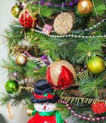 Christmas artificial tree decorated with toys