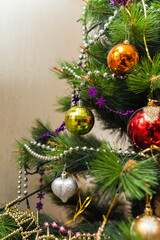 Christmas artificial tree decorated with toys