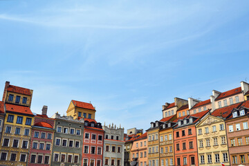Fototapeta na wymiar Warsaw (Warszawa) old town (Stare Miasto) architecture, vintage buildings, rebuild after world war II in Poland. Beautiful sunny day in the city.