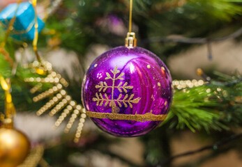 Christmas artificial tree decorated with toys