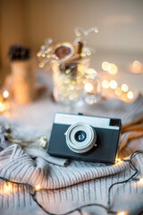 Flat lay composition with camera, Christmas decor on wooden background, travel for Chrismas...