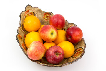 fresh fruits in a clay bowl