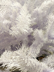 white branches of an artificial Christmas tree close-up. mobile photo